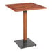 A Lancaster Table & Seating wooden table with a metal base.