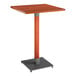 A Lancaster Table & Seating bar height table with a wooden top and metal base.