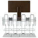 A metal Numi tea display rack with four metal stands and a brown sign.