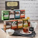 A Numi tea display rack holding boxes of tea on a table in an organic food store.