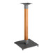 A metal and wood Lancaster Table & Seating bar height table base with a honey maple finish.