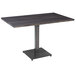 A Lancaster Table & Seating solid wood live edge dining table with a metal base in an antique slate gray finish.