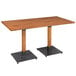 A Lancaster Table & Seating solid wood live edge dining table with black metal legs.