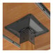 A metal bracket on a Lancaster Table & Seating wood table.
