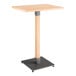 A Lancaster Table & Seating wooden bar table with a metal base.