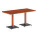 A Lancaster Table & Seating live edge wood table with a metal base.