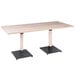 A Lancaster Table & Seating live edge dining table with legs.