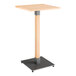 A Lancaster Table & Seating square wooden bar height table with a metal base.