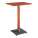 A Lancaster Table & Seating live edge bar height table with a wooden top and metal base.
