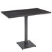 A Lancaster Table & Seating live edge bar table with a black metal base.