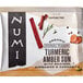 A box of 15 Numi Organic Amber Sun Turmeric Tea Bags on a table.