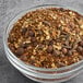 A bowl of Numi Organic Rooibos Chai spices and herbs.