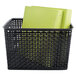 A black plastic weave bin with green folders inside.