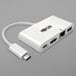 A white Tripp Lite USB-C to HDMI adapter with a USB cable.