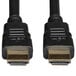 A pair of Tripp Lite black HDMI cables with gold-plated connectors.