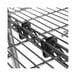 A close-up of a black metal Alera S hook on a metal rack.