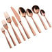 A close-up of a group of rose gold Bon Chef bouillon spoons.