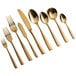 A close-up of a few gold Bon Chef Manhattan soup spoons.