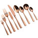 A close-up of a few rose gold Bon Chef Manhattan dinner forks.