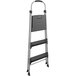 A black and silver Cosco step ladder with a handle.