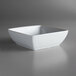 A white porcelain square bowl with a silver rim.