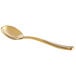 A close-up of the matte gold handle of a Bon Chef Manhattan stainless steel bouillon spoon.