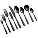 A close-up of a black Bon Chef Manhattan stainless steel teaspoon.