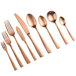 A close-up of a set of rose gold Bon Chef Manhattan oyster forks.