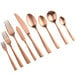 A close-up of a set of Bon Chef matte rose gold stainless steel European dinner forks.