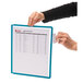 A person using a Durable VARIO desktop reference system to view white papers.