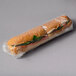 A sandwich wrapped in LK Packaging clear plastic.