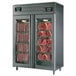 A Maturmeat stainless steel meat aging and curing cabinet with two glass doors filled with meat.