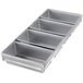 A silver rectangular Chicago Metallic bread loaf pan with four compartments.