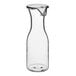 A clear polycarbonate decanter with a lid.