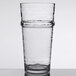 A Libbey Tritan plastic stackable cooler glass of water on a table.