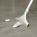 A Unger medium duty floor scraper with a sticker on it.