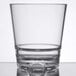 A close up of a Libbey Tritan plastic rocks glass with a small bottom.