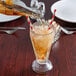 A glass of Boylan Natural Creme Soda with a straw.