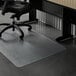 A black chair with wheels on an ES Robbins clear vinyl chair mat.