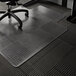 A black office chair with wheels on a clear ES Robbins chair mat.