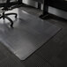 A black and gray ES Robbins office chair on a clear vinyl rectangle chair mat.