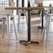 A Lancaster Table & Seating black cast iron counter height table base.