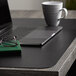 a laptop and a mug on a desk