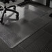 A black and white office chair with ES Robbins clear vinyl chair mat with Crystal Edge on a carpeted floor.