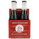 A Boylan Bottling Co. Creamy Red Birch Beer bottle with a label filled with dark red liquid.