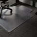 A clear ES Robbins vinyl chair mat with a lip on a carpeted floor.