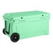 A seafoam green CaterGator outdoor cooler with black wheels.