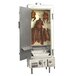 A Town stainless steel indoor smokehouse with a door open and a large rack of meat inside.