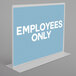 A close-up of a clear double-sided sign holder with white text on it.