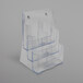 A clear Deflecto 6-compartment brochure holder.